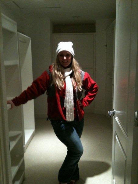 Tiffany in the walk in closet in the master